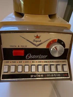 Sale Photo Thumbnail #469: Vintage Osterizer Imperial Pulse-Matic 10-speed blender base in a harvest gold finish, featuring push-button speed controls and a rotary power dial.