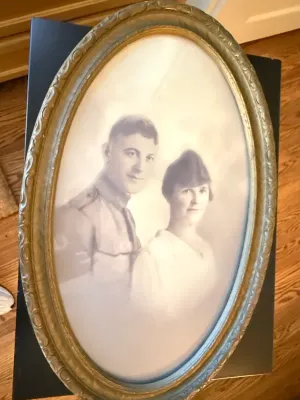 Sale Photo Thumbnail #340: Vintage black and white portrait of a military couple in an ornate oval gilt frame with bubble glass.