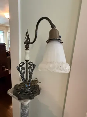 Sale Photo Thumbnail #345: Vintage cast metal bridge arm table lamp featuring an ornate scrollwork base, alabaster accents, and a frosted white glass shade.