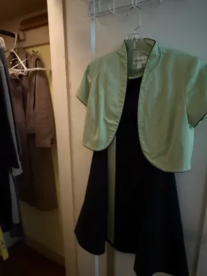 Sale Photo Thumbnail #272: Studio I two-piece dress set featuring a black sleeveless dress paired with a cropped, mint green short-sleeve jacket.