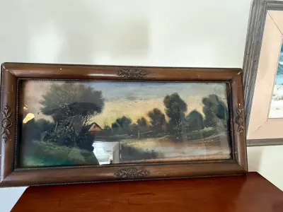 Sale Photo Thumbnail #289: Antique panoramic landscape print housed in a carved dark wood frame with ornate corner and edge accents.