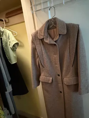 Sale Photo Thumbnail #339: Vintage beige textured wool-blend overcoat with dark piping details, front flap pockets, and button closures.