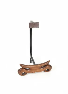 Sale Photo Thumbnail #320: Single-item display stand featuring a carved wooden cradle base attached to a black metal upright support.