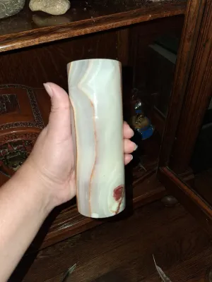 Sale Photo Thumbnail #48: Cylindrical carved onyx marble vase with light green, cream, and brown veining.