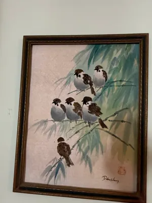 Sale Photo Thumbnail #395: Framed Asian watercolor painting depicting sparrows perched in bamboo branches, signed with a red seal stamp and signature in the lower right.