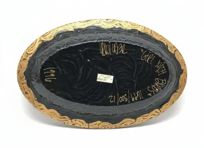 Sale Photo Thumbnail #33: Underside of a 1996 hand-painted lacquered box featuring gold artist signatures and titled "Girl With Birds".