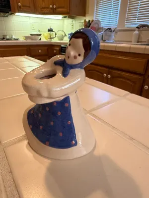 Sale Photo Thumbnail #497: Vintage glazed ceramic figural vase or holder shaped like a woman in a blue kerchief and polka dot apron.