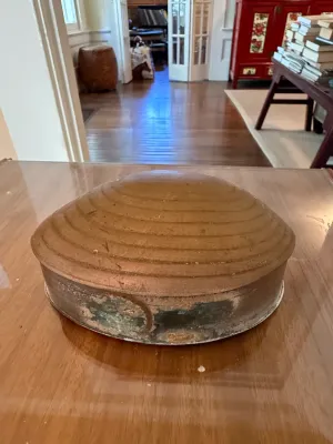 Sale Photo Thumbnail #279: Vintage pottery covered dish featuring a ridged, domed lid and a muted earthy glaze with natural surface wear.