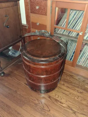 Sale Photo Thumbnail #82: Traditional Chinese antique three-tier wooden wedding basket with a bentwood handle and lacquer finish, showing moderate surface wear.