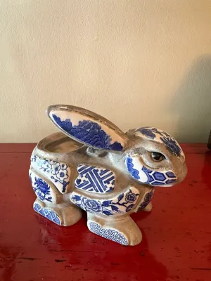 Sale Photo Thumbnail #147: Vintage ceramic rabbit-shaped planter featuring blue and white glazed transferware tiles in a patchwork design.