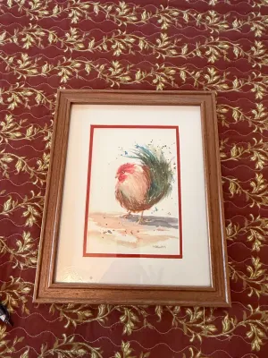 Sale Photo Thumbnail #224: Framed original watercolor painting of a rooster, signed by the artist, in a medium wood frame with red matting.