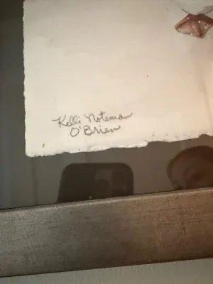 Sale Photo Thumbnail #263: Detail shot showing the artist signature, Kelli Noteman O'Brien, on a framed original artwork with deckled edge paper.