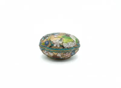 Sale Photo Thumbnail #66: Vintage Chinese cloisonné enamel trinket box featuring intricate floral and butterfly motifs over a textured gilt ground.