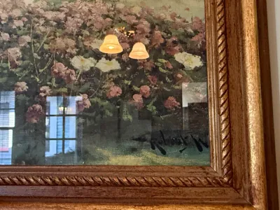 Sale Photo Thumbnail #312: Detail of a framed landscape painting featuring a floral garden scene, signed Robert Wood in the lower right corner.