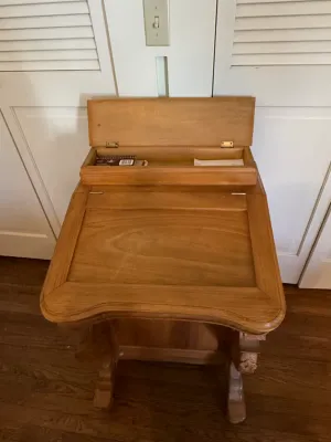 Sale Photo Thumbnail #317: Vintage light oak Davenport-style slant-top desk featuring a hinged upper compartment for stationery storage.