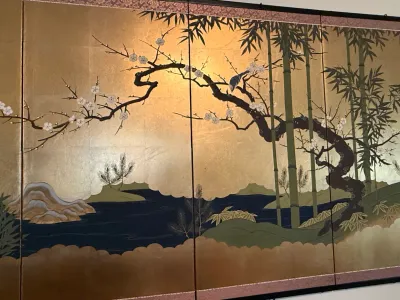 Sale Photo Thumbnail #219: Japanese four-panel folding screen featuring painted bamboo, plum blossoms, and a bird on a gold leaf background.