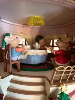 Sale Photo Thumbnail #491: Enclosed miniature scene depicting a mouse family enjoying a festive meal inside a decorated room, complete with an overhead light and Christmas tree detail.