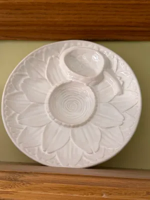 Sale Photo Thumbnail #472: White ceramic floral serving platter with built-in dip bowl and small spoon resting in a notch.