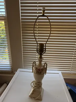 Sale Photo Thumbnail #381: Vintage ceramic urn-style table lamp featuring sculpted pink rose details, double handles, and brass harp fitting, missing shade.