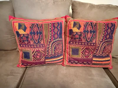 Sale Photo Thumbnail #225: Pair of embroidered bohemian throw pillows featuring vibrant patchwork textiles and geometric patterns.