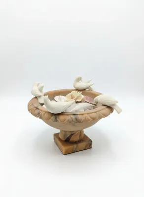 Sale Photo Thumbnail #22: Italian carved alabaster bird bath compote with four detachable white birds, filled with seashells and feathers.