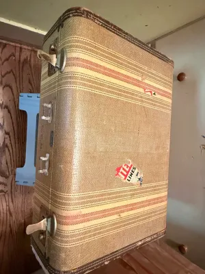 Sale Photo Thumbnail #288: Vintage mid-century striped tweed suitcase with metal latches and a United Air Lines sticker.