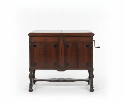 Sale Photo Thumbnail #13: Antique dark mahogany hand-crank phonograph console cabinet with carved turned legs and stretcher base, circa 1920s.