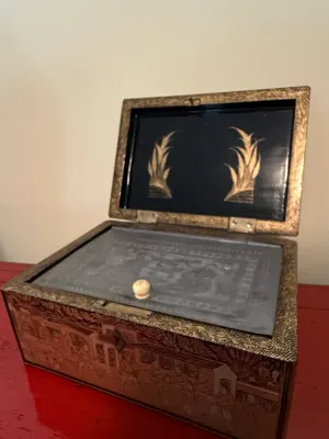 Sale Photo Thumbnail #127: Antique Chinese export lacquer box featuring detailed gilt Chinoiserie village scenes and an etched glass interior lid.