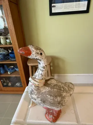 Sale Photo Thumbnail #429: Vintage painted goose statue with heavily distressed, flaking white and red paint and a fabric neck scarf.