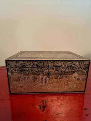 Sale Photo Thumbnail #132: Antique Chinese export black and gold lacquer tea caddy or box, featuring detailed hand-painted narrative scenes and a brass keyhole.