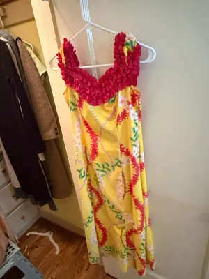 Sale Photo Thumbnail #326: Vintage yellow Hawaiian muumuu dress featuring a floral lei print and a ruffled magenta trim around the neckline.