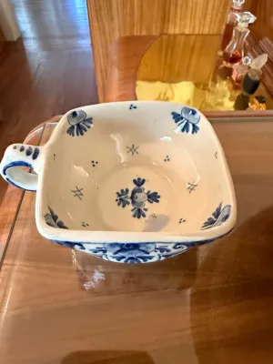 Sale Photo Thumbnail #283: Vintage hand-painted blue and white glazed ceramic dish with side handles, featuring traditional floral motifs.