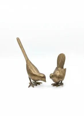 Sale Photo Thumbnail #57: Pair of vintage brass bird figurines featuring detailed feather texturing and a aged patina.