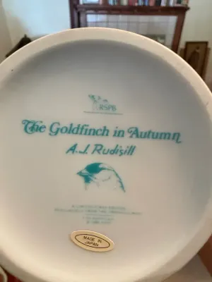 Sale Photo Thumbnail #134: Underside maker's mark on a 1986 Franklin Mint porcelain vase titled "The Goldfinch in Autumn" by A.J. Rudisill, made in Japan.