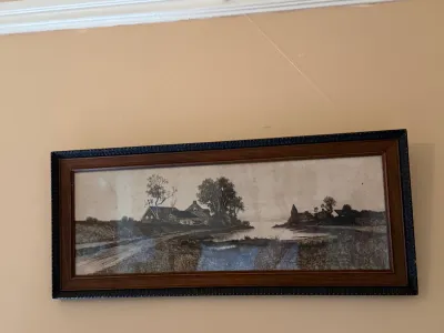 Sale Photo Thumbnail #203: Framed panoramic print depicting a rural landscape with farmhouses along a waterway, housed in a dark wood frame.