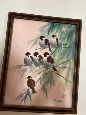 Sale Photo Thumbnail #394: Framed Asian watercolor painting depicting sparrows perched on bamboo branches, signed with a artist signature and red chop mark.