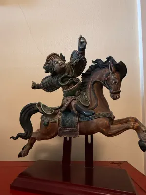 Sale Photo Thumbnail #146: Hand-carved and polychromed Asian wooden sculpture depicting an armored warrior mounted on a rearing horse, mounted on a custom wooden display stand.