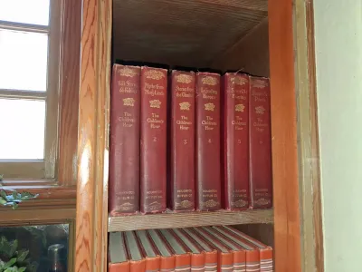 Sale Photo Thumbnail #109: Set of six vintage reddish-maroon hardbound books titled "The Children's Hour" published by Houghton Mifflin Co., displaying gilt spine titles and floral accents.