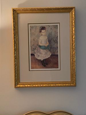 Framed art print of Pierre-Auguste Renoir's portrait of a young girl, presented in an ornate gilded wood frame with wide matting.