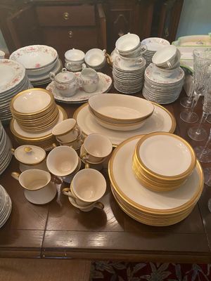 Extensive fine china dinnerware collections including Lenox gold-trimmed place settings, floral china, teacups, serving bowls, and...