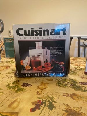 Vintage Cuisinart juice extractor in its original retail packaging.