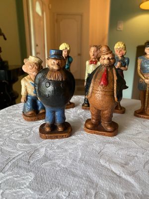 Collection of vintage 1970s Syroco molded resin comic strip character figurines, including The Capt., Wimpy, and Barney Google, displayed...
