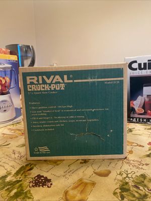 Vintage Rival Crock-Pot 2 1/2 quart slow cooker Model 3120, in its original box displaying minor wear and tear.