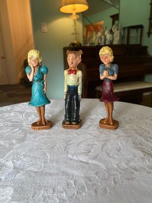 Set of three vintage Blondie comic strip character statuettes featuring Blondie, Dagwood, and Tootsie on wood-look bases.