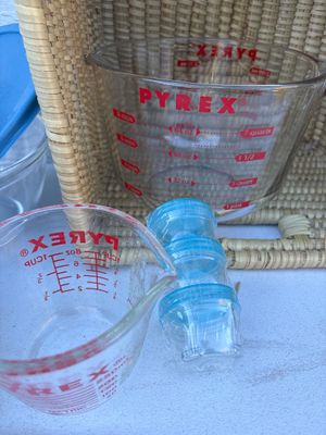 Sale Photo Thumbnail #224: Covered Pyrex bowls, and measuring cups with basket