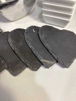 Sale Photo Thumbnail #43: Eight heart shaped slate coasters, heart bowl and spoon, five round black balls, four black balls and nine square white bowls