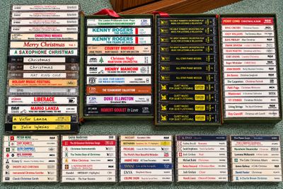 Sale Photo Thumbnail #15: Large collection of cassette tapes featuring Christmas music, classical compilations, and pop classics arranged in box sets and individual jewel cases.