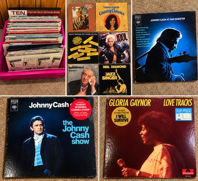 Sale Photo Thumbnail #24: Collection of vintage vinyl LP records, including a pink crate full of albums and highlighted titles from Johnny Cash, Gloria Gaynor, Billy Idol, and Rodney Dangerfield.
