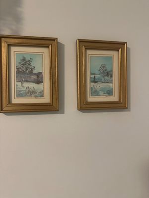 Sale Photo Thumbnail #20: Pair of framed watercolor landscape prints depicting wintry scenes, presented in matching ornate gold-painted frames with double matting.