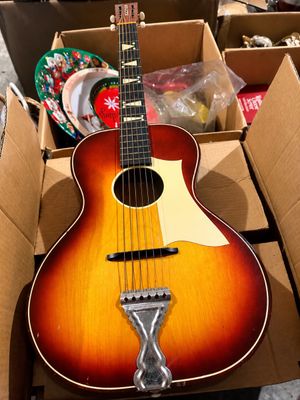 Sale Photo Thumbnail #29: Vintage sunburst acoustic parlor guitar with white pickguard, floating bridge, metal tailpiece, and geometric fretboard inlays.